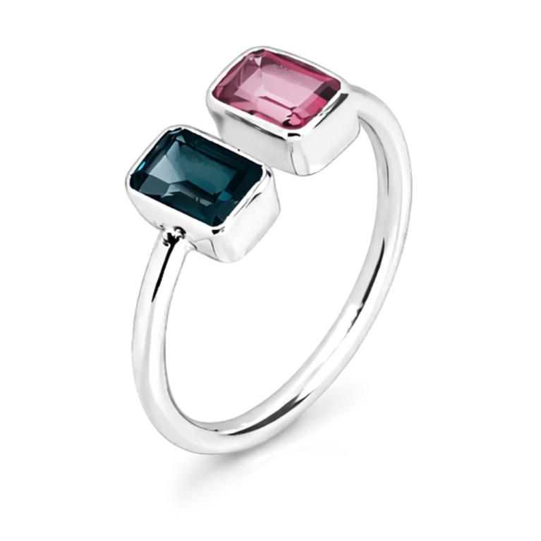 Handmade sterling silver open ring featuring genuine emerald cut pink tourmaline and London blue topaz gemstones in polished bezel settings with an ultra mirror polished 925 sterling silver band on a white background.