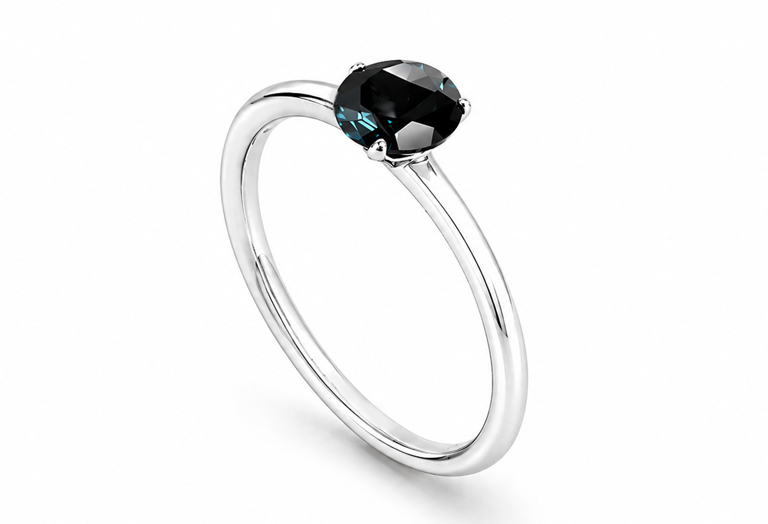 Handmade 925 sterling silver solitaire ring featuring a natural round London Blue Topaz in a classic four-prong setting with a high mirror polish finish.