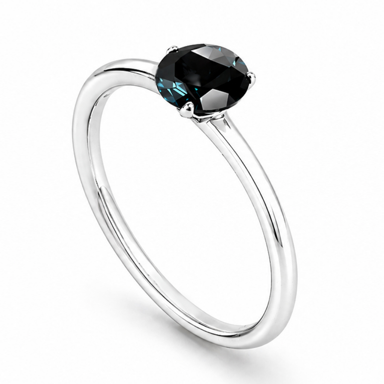 Handmade 925 sterling silver solitaire ring featuring a natural round London Blue Topaz in a classic four-prong setting with a high mirror polish finish.