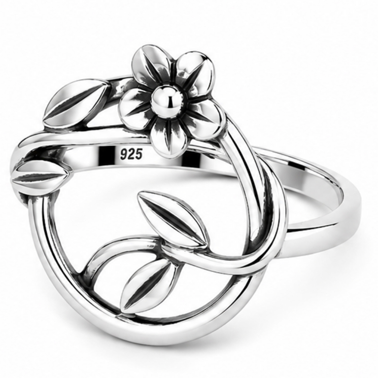 Handmade sterling silver floral ring featuring a sculpted flower, flowing vine, and polished leaves within an elegant open oval frame with an ultra mirror polished finish on a white background.
