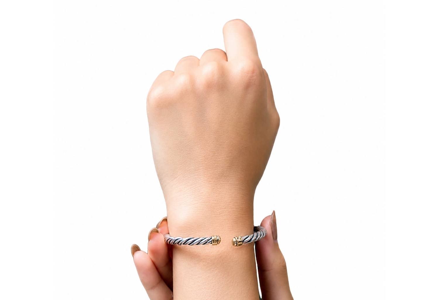 Handmade twisted cable cuff bracelet in sterling silver with polished gold accents, open bangle design for women.