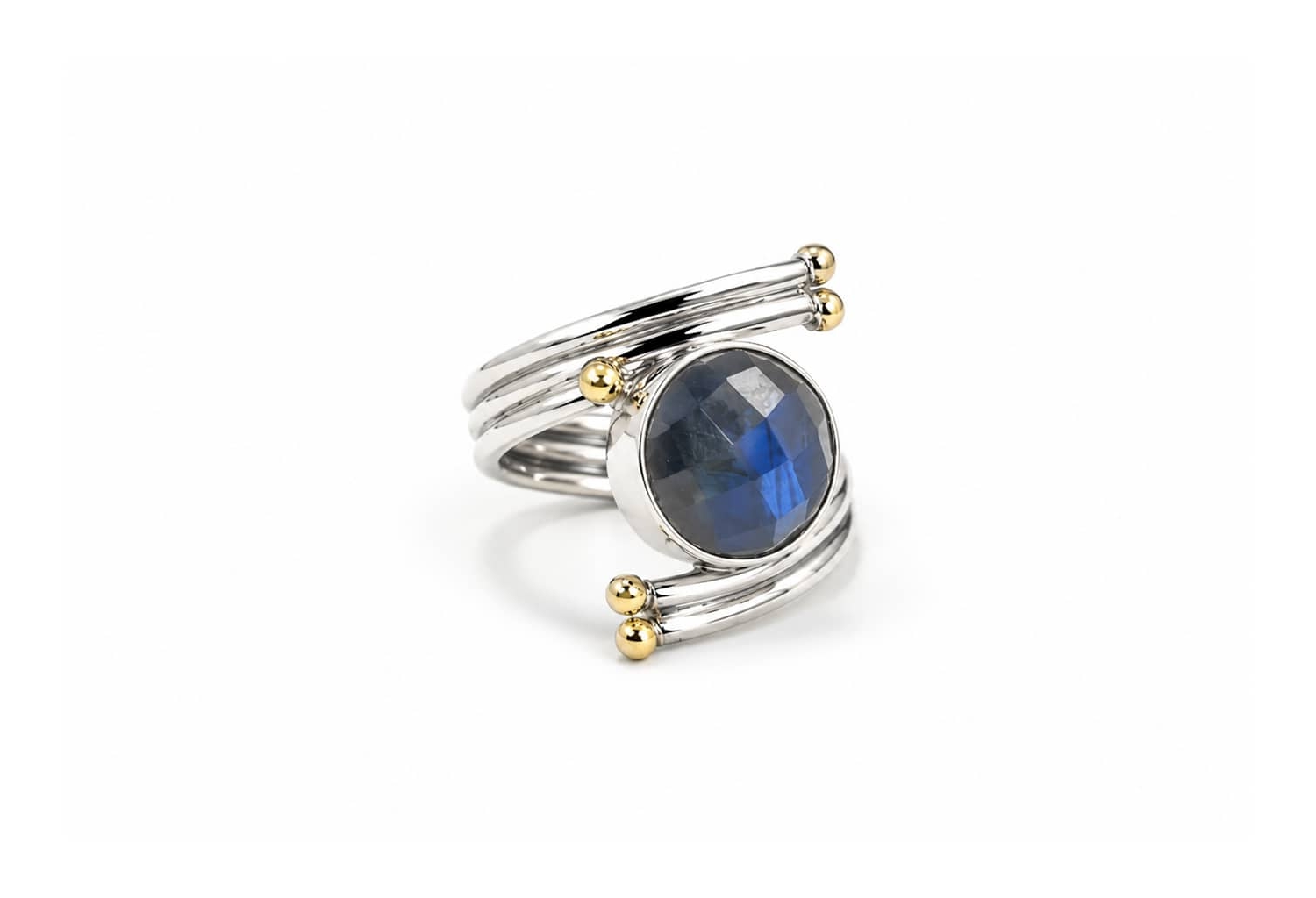 Handmade sterling silver labradorite statement ring with faceted labradorite gemstone and gold accent details.