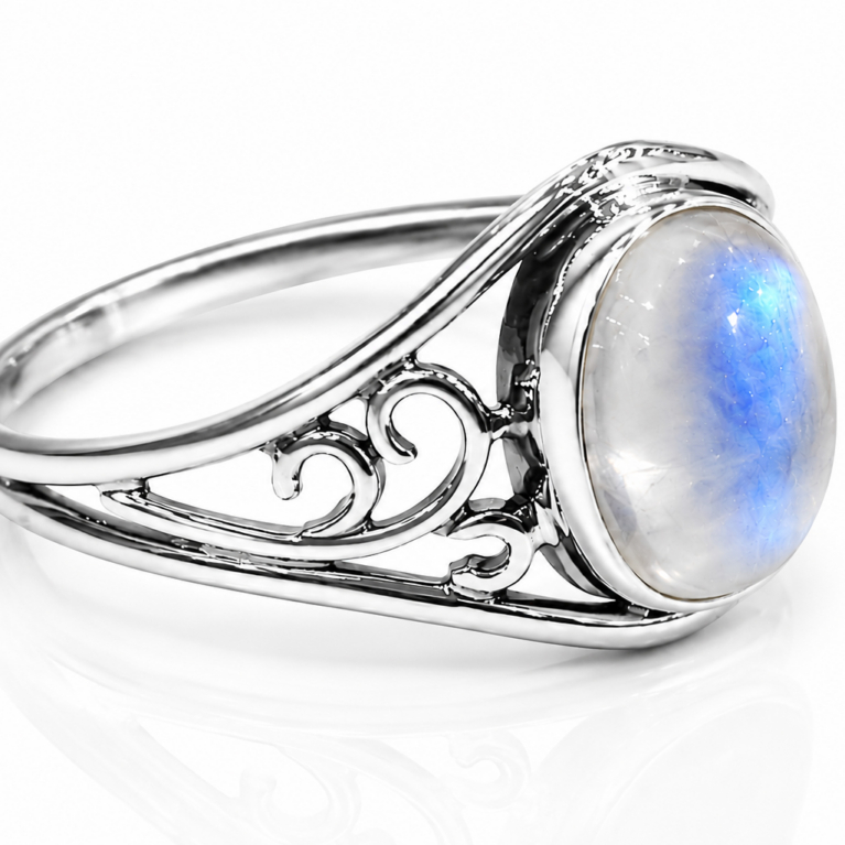 Handcrafted 925 sterling silver moonstone ring featuring a natural oval rainbow moonstone in a smooth bezel setting with an elegant filigree split shank.