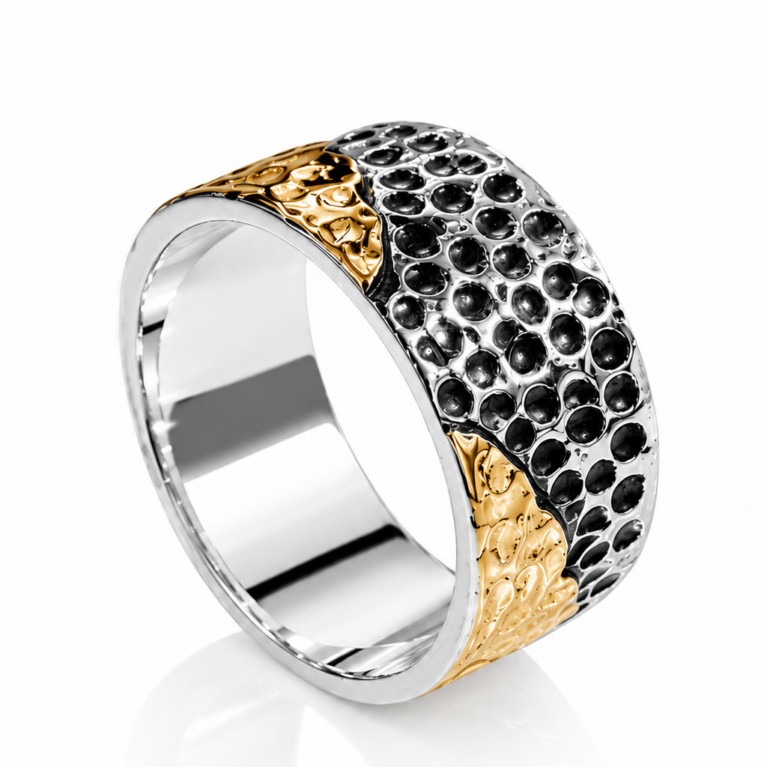 Handcrafted sterling silver hammered band ring with textured finish and gold accents on a white background.