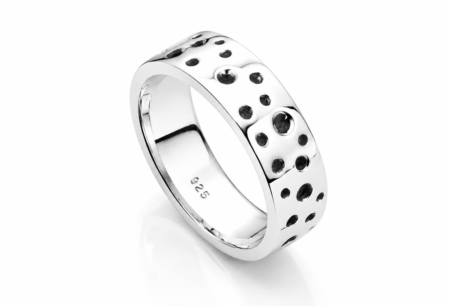 Handmade sterling silver crater ring featuring organic recessed circular detailing, oxidized accents, and an ultra mirror polished finish on a white background.